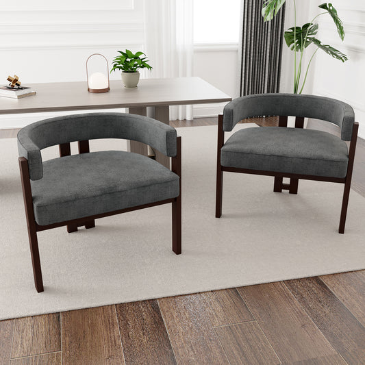 Two modern upholstered accent chairs with dark wood frames in a living room setting