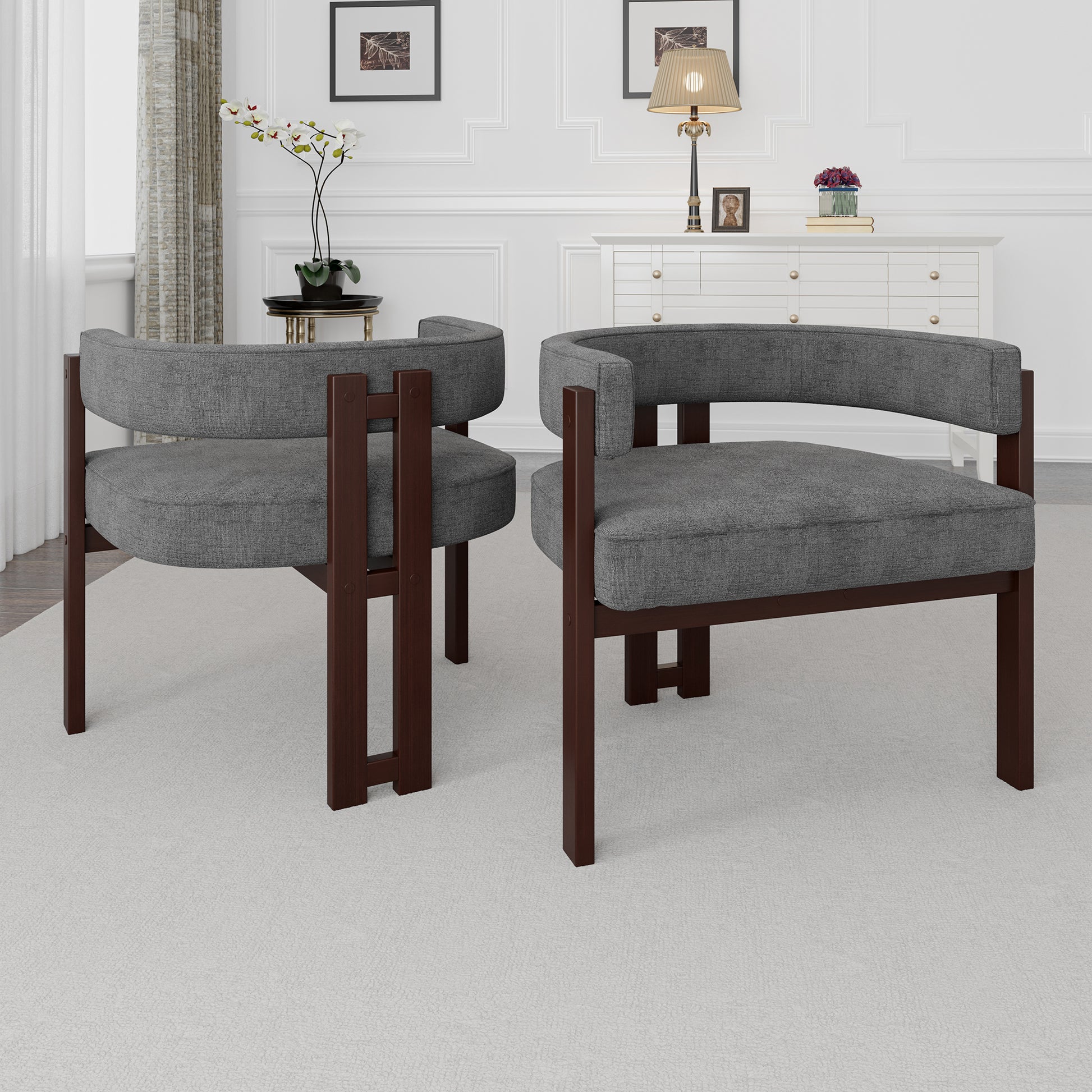 Pair of grey upholstered accent chairs with dark wood frames
