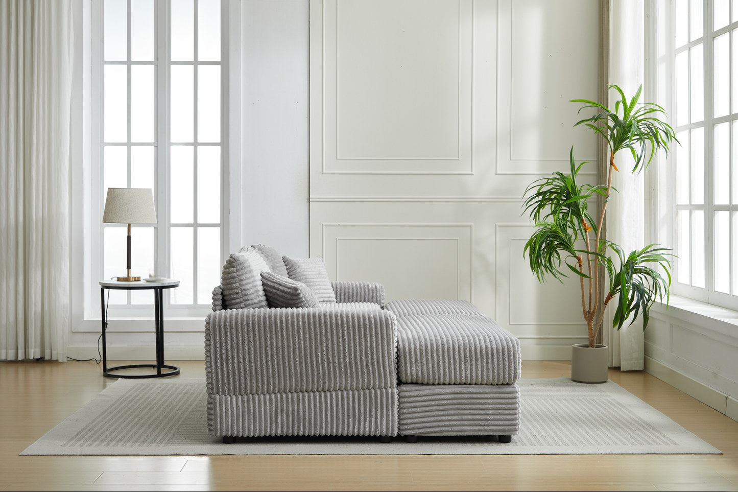 Grey corduroy sectional sofa with plush throw pillows perfect for modern living rooms