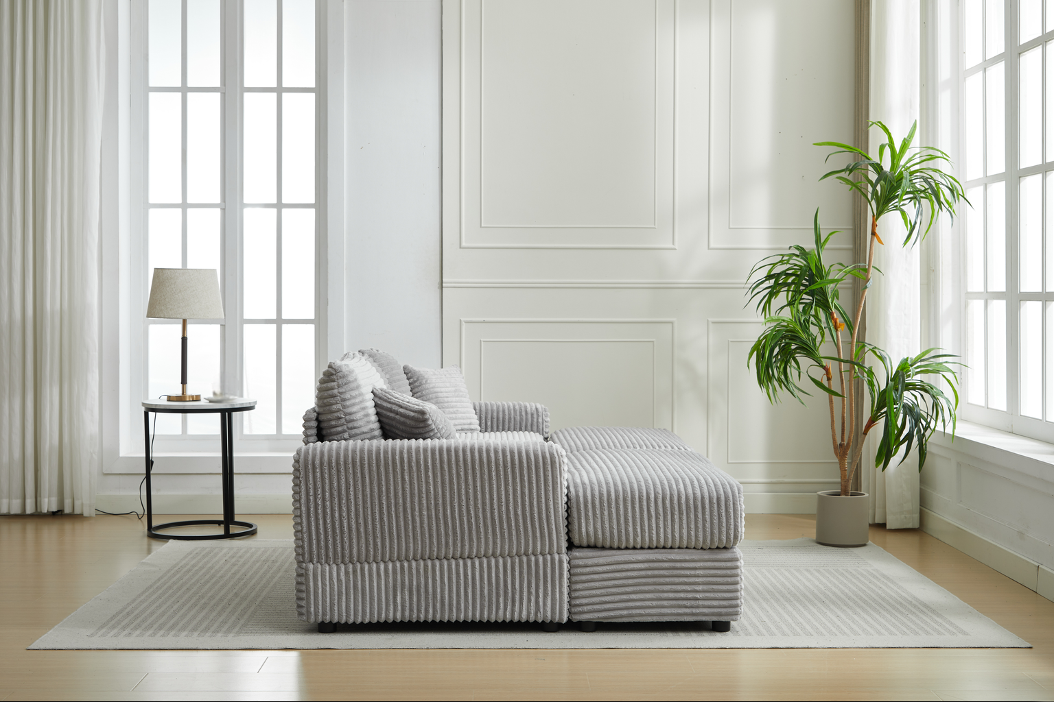 Grey corduroy sectional sofa with plush throw pillows perfect for modern living rooms