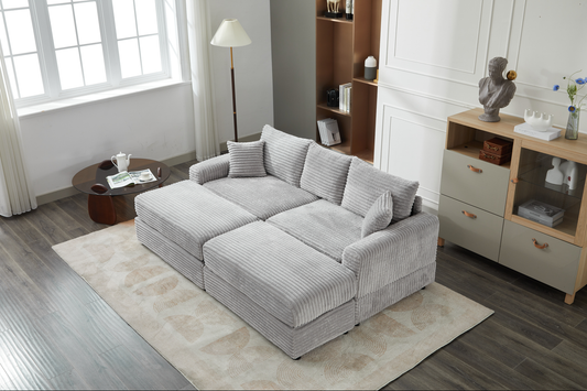 Sectional corduroy sofa in light grey with plush cushions and removable chaise