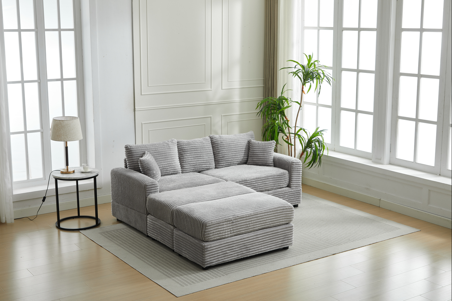Gray corduroy sectional sofa with chaise and throw pillows