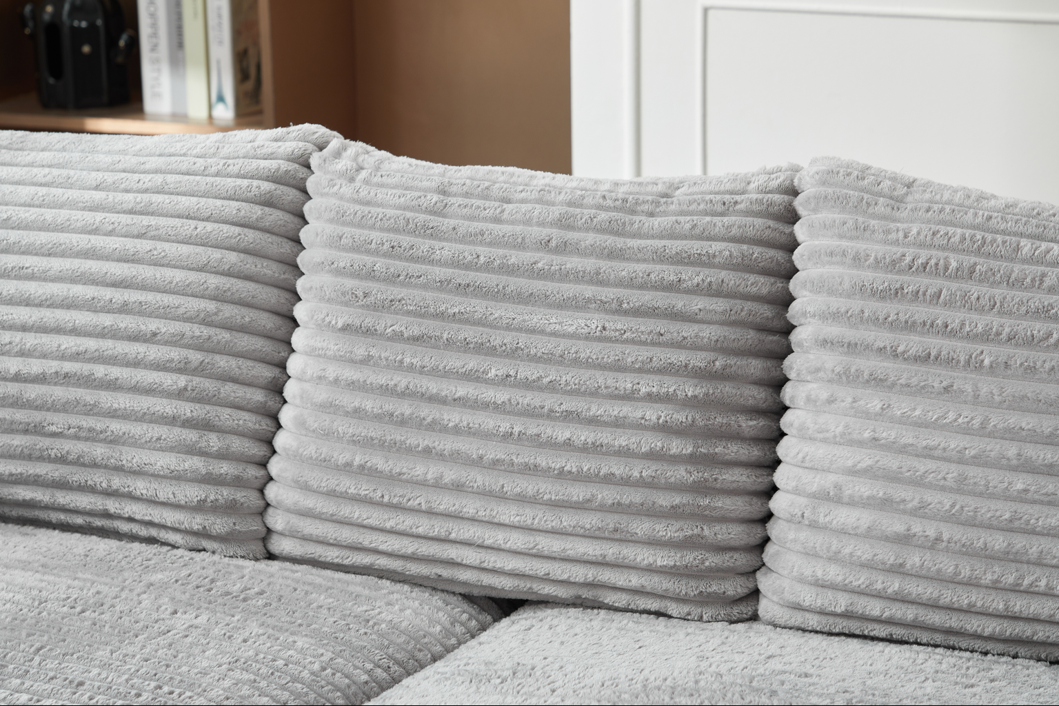 Soft grey corduroy throw pillow with plush texture for cozy living rooms