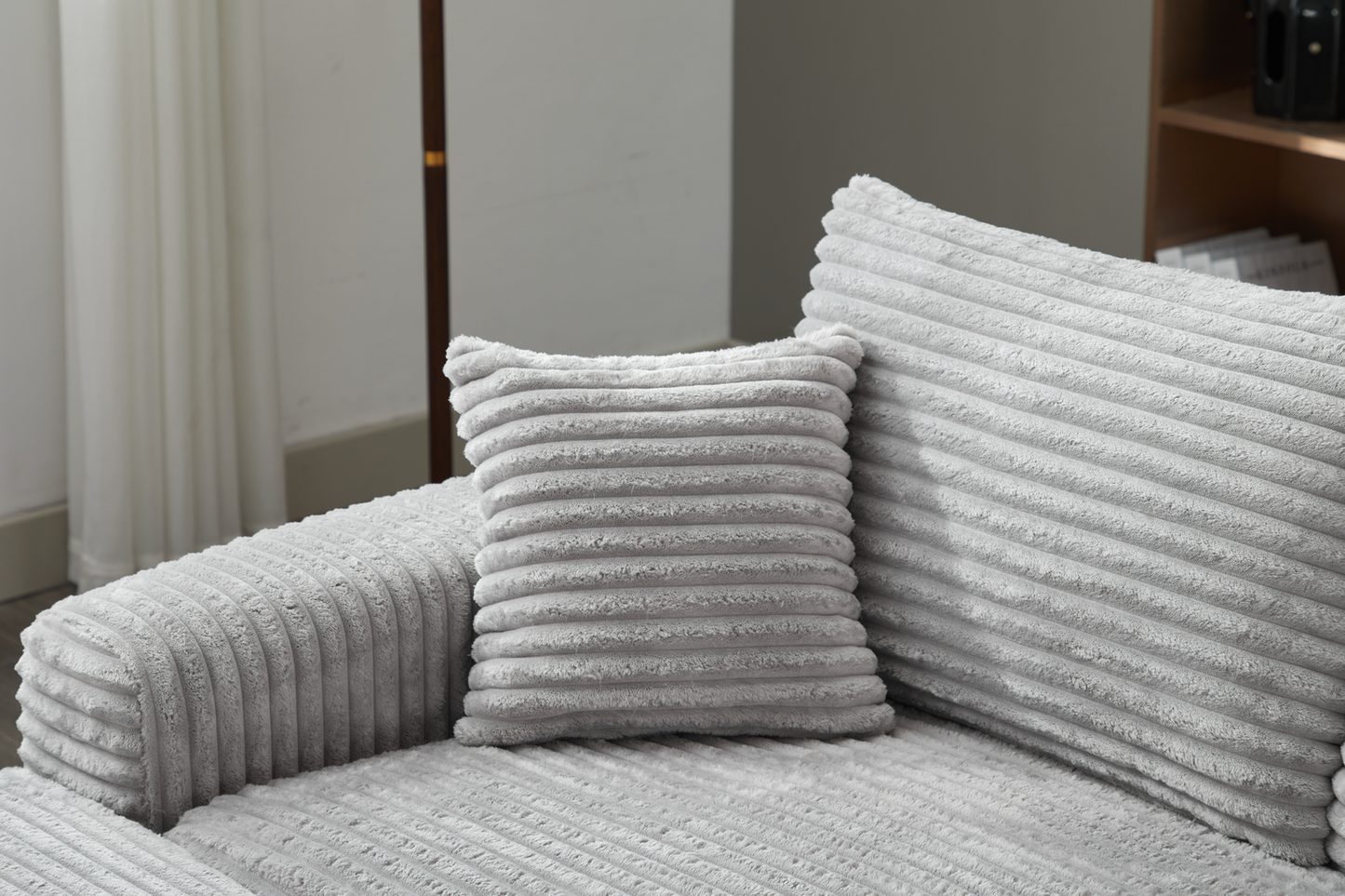 Soft grey corduroy accent pillow with textured ribbed design