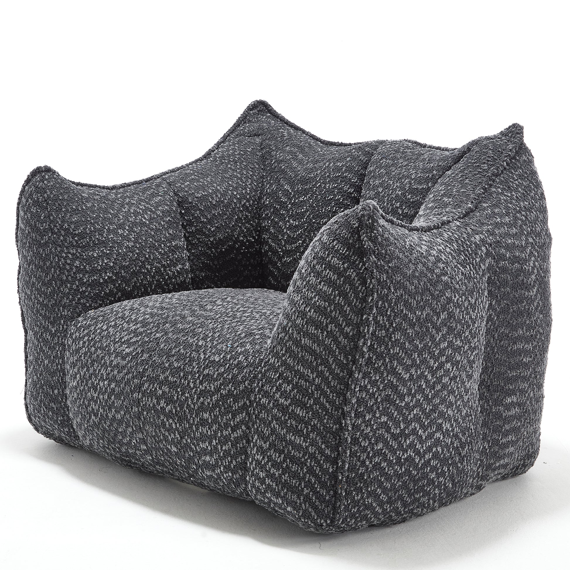 Textured grey armchair with plush cushioning and a modern lowprofile design