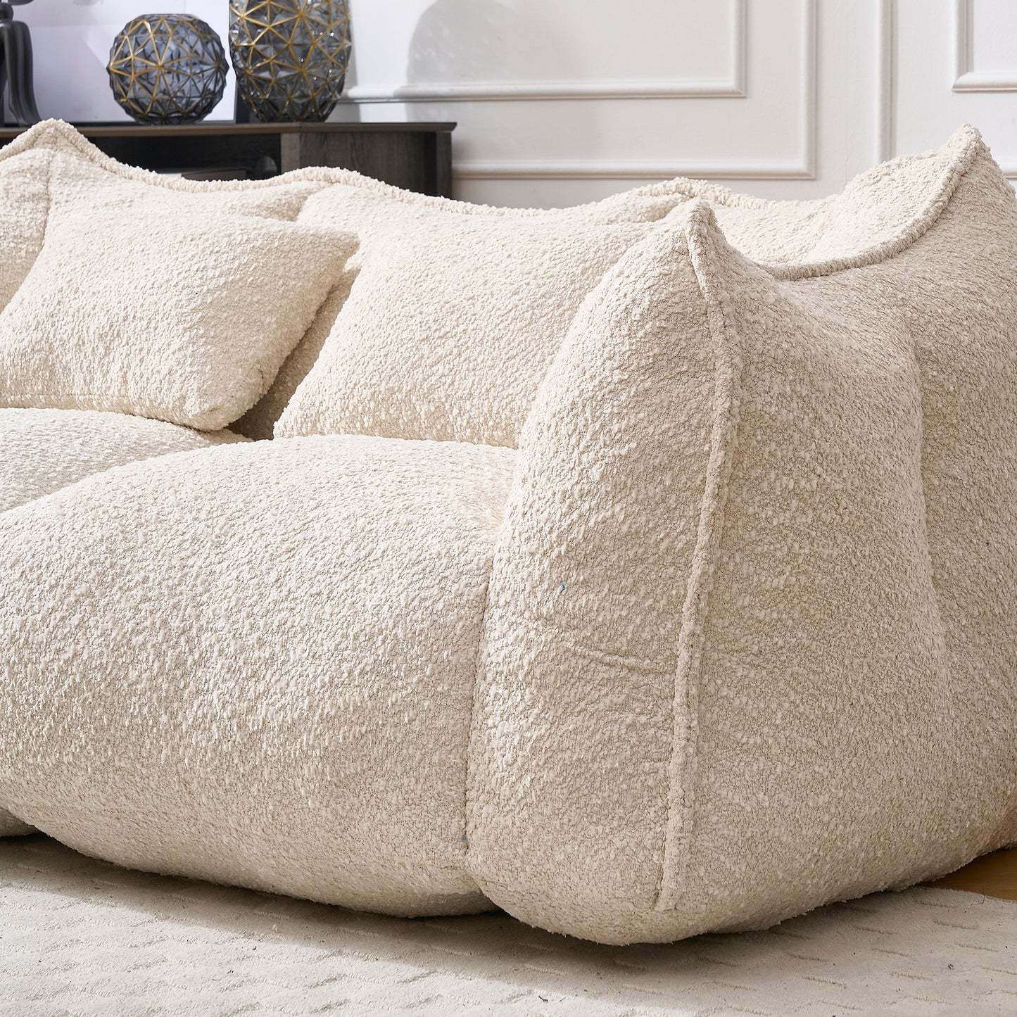 Cream boucle sectional sofa with plush cushions