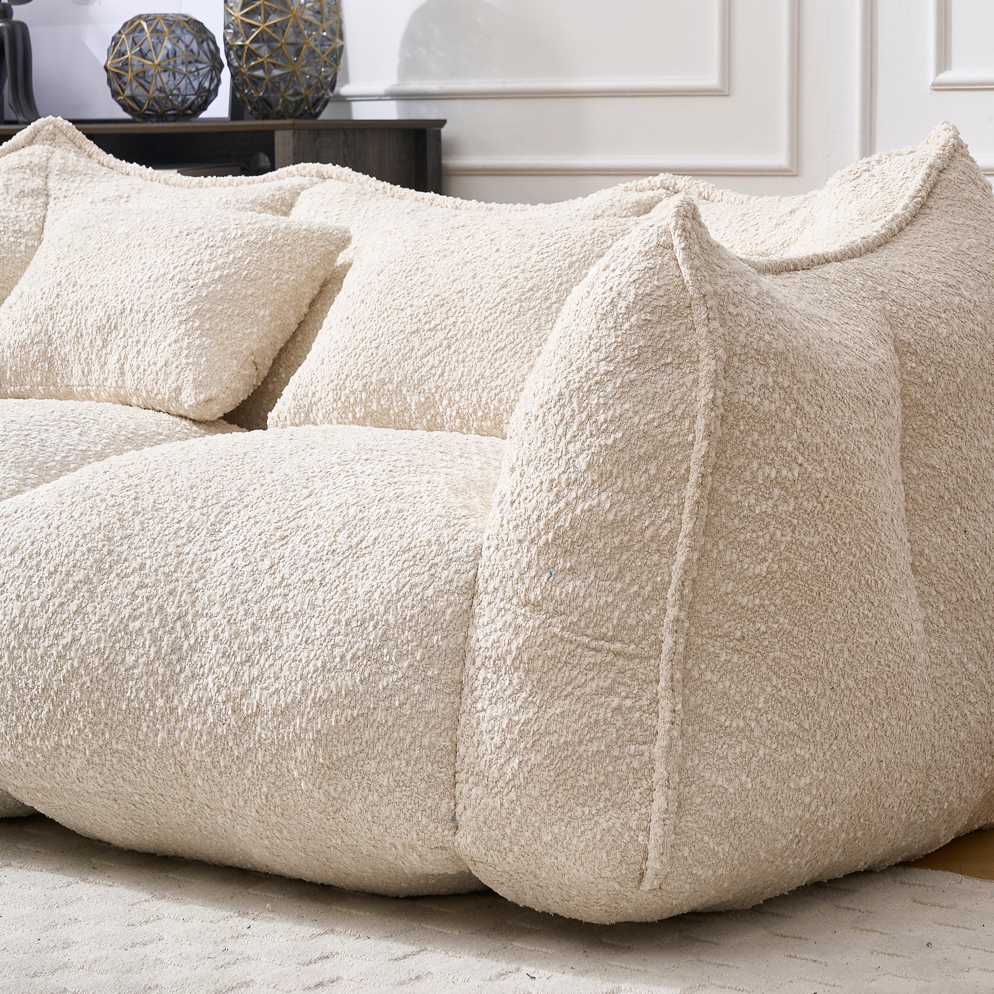 Cream boucle sectional sofa with plush cushions