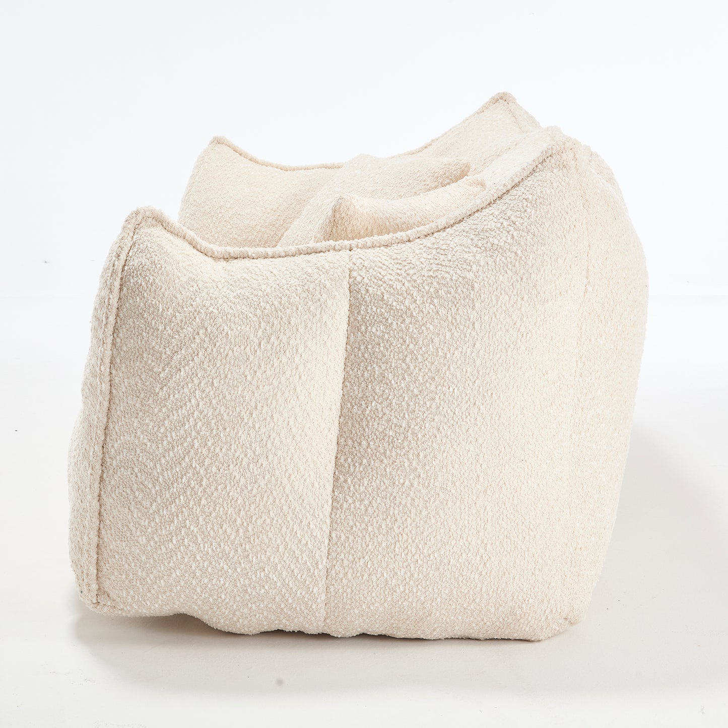 Cream boucle fabric accent chair with rounded sculptural form modern living room accent