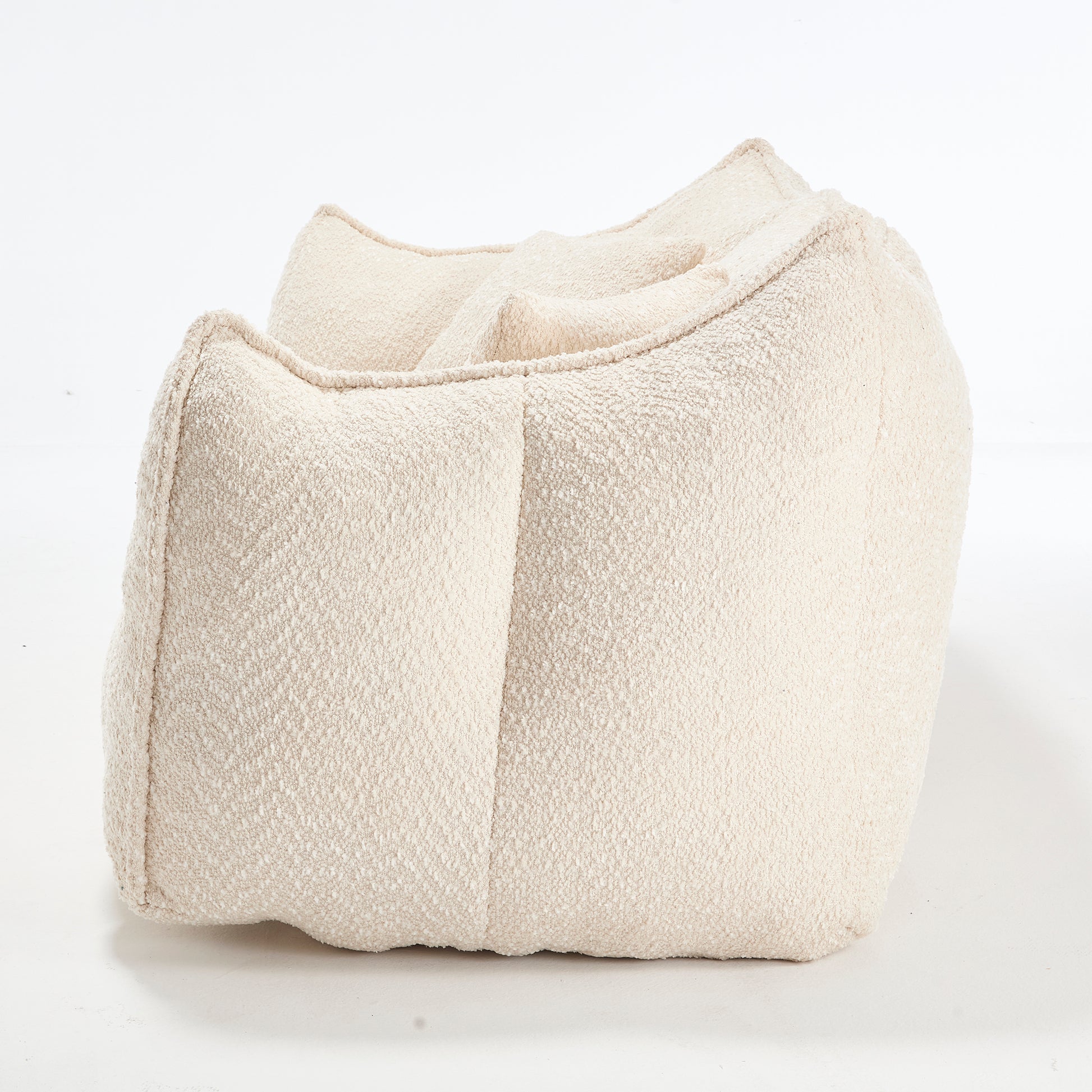 Cream boucle fabric accent chair with rounded sculptural form modern living room accent