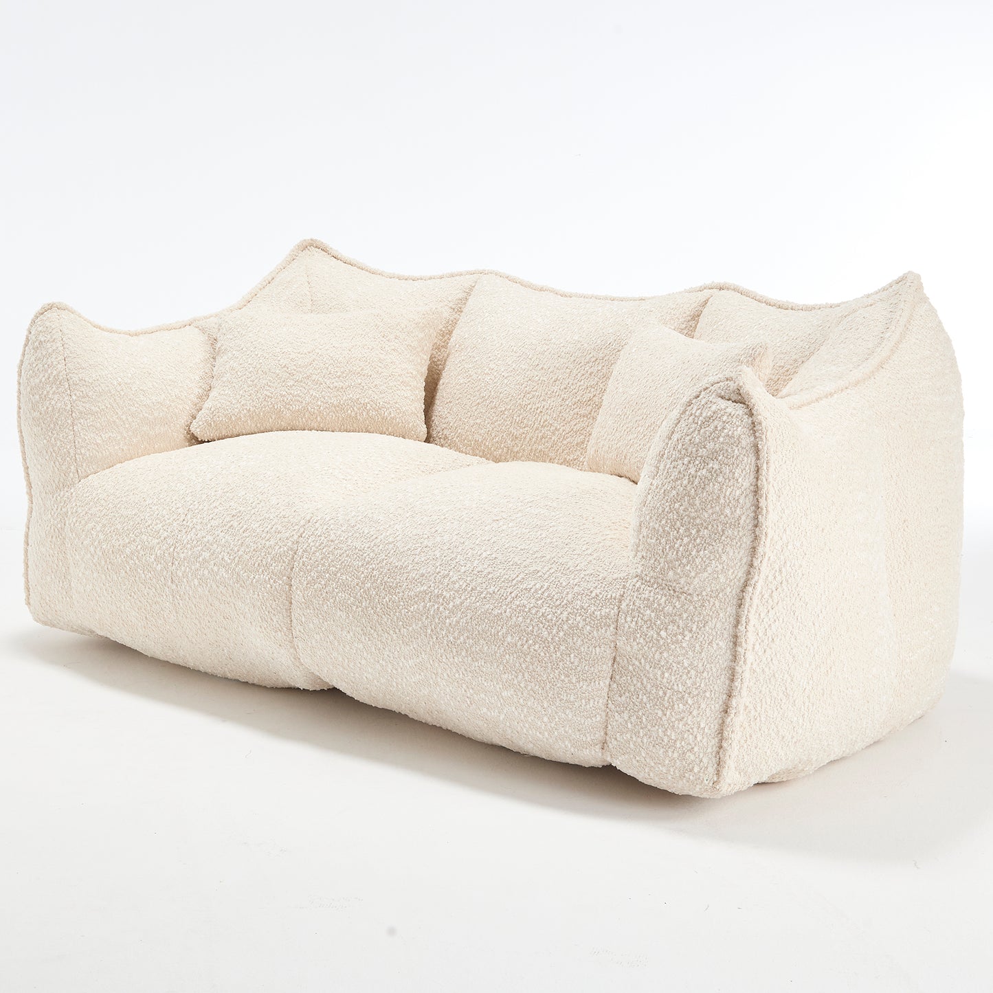 Plush cream boucle fabric sofa with rounded arms and back featuring accent pillows for comfort and style