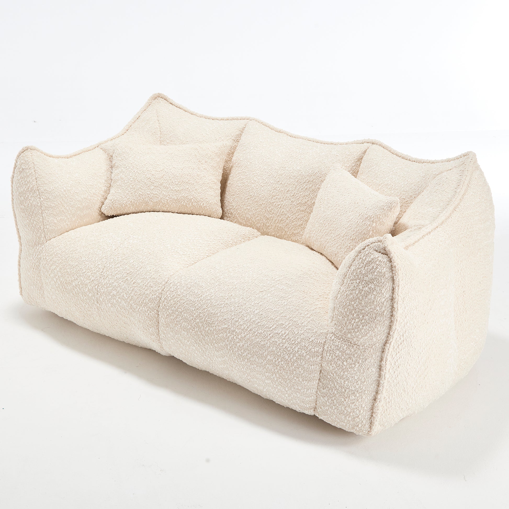 Cream boucl sofa with plush cushions modern organic design