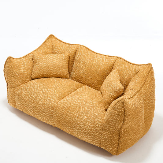 A modern mustard yellow textured fabric loveseat with plush cushions for comfortable seating