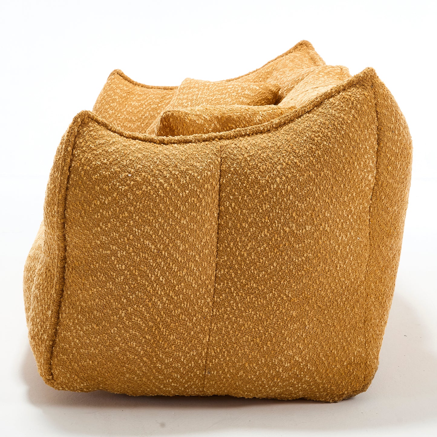 Textured ochre bean bag chair with plush inviting cushions