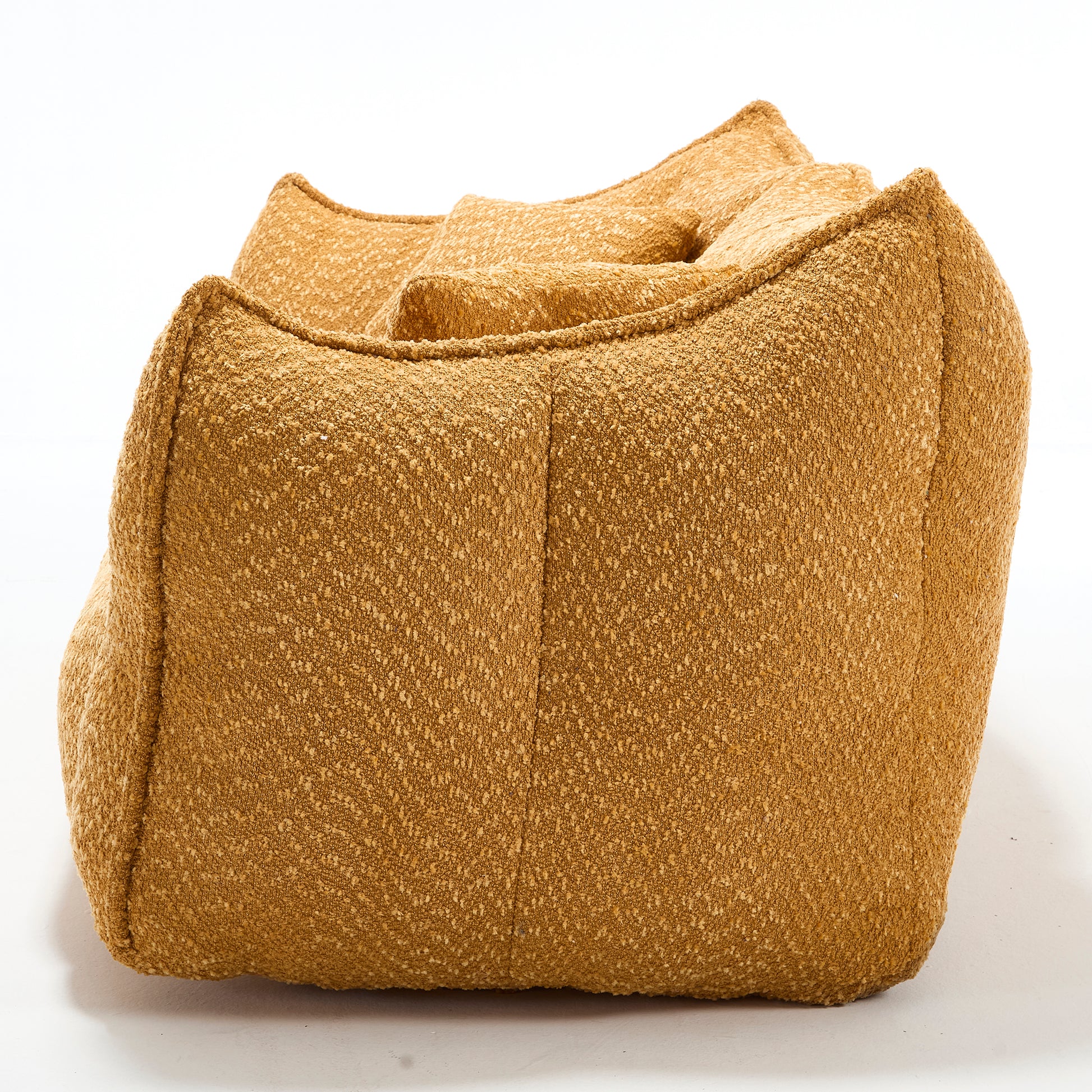 Textured ochre bean bag chair with plush inviting cushions