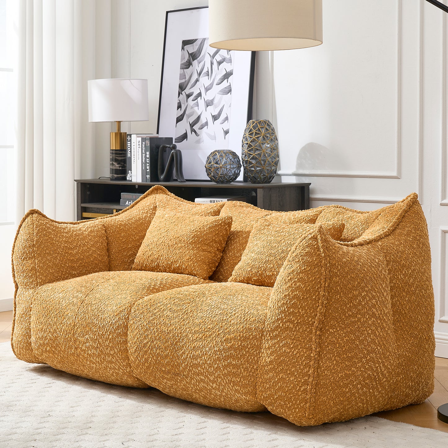 Plush mustard yellow boucle fabric sofa with plush cushions for a cozy living room