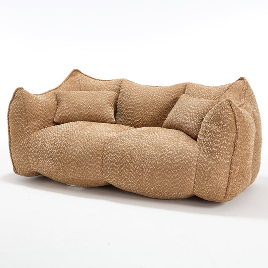 Textured beige sofa with plush cushions creating a cozy and inviting living room seating option
