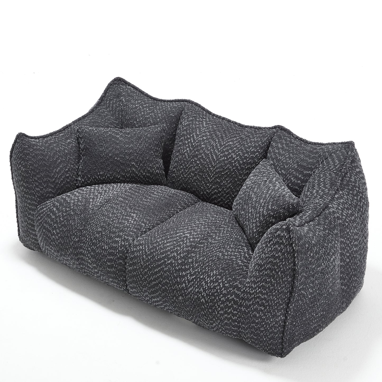 Dark grey upholstered sofa with a textured herringbone weave fabric and plush cushions