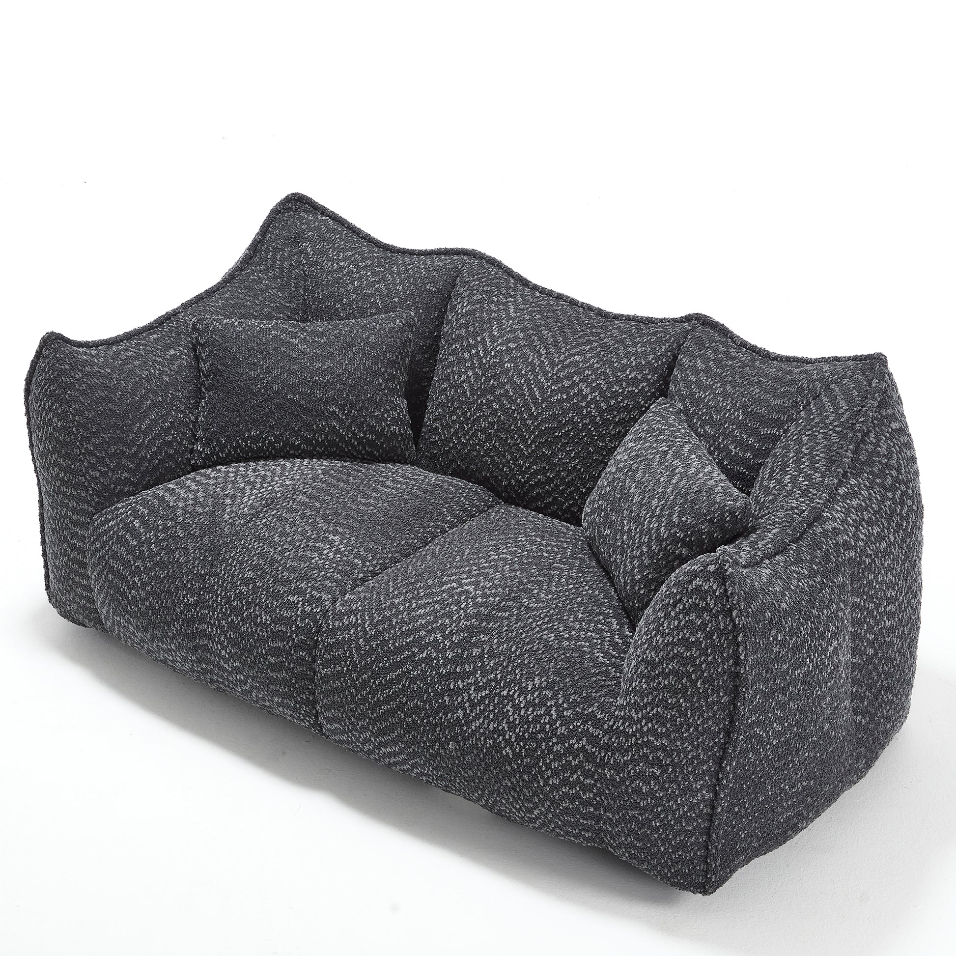 Dark grey upholstered sofa with a textured herringbone weave fabric and plush cushions