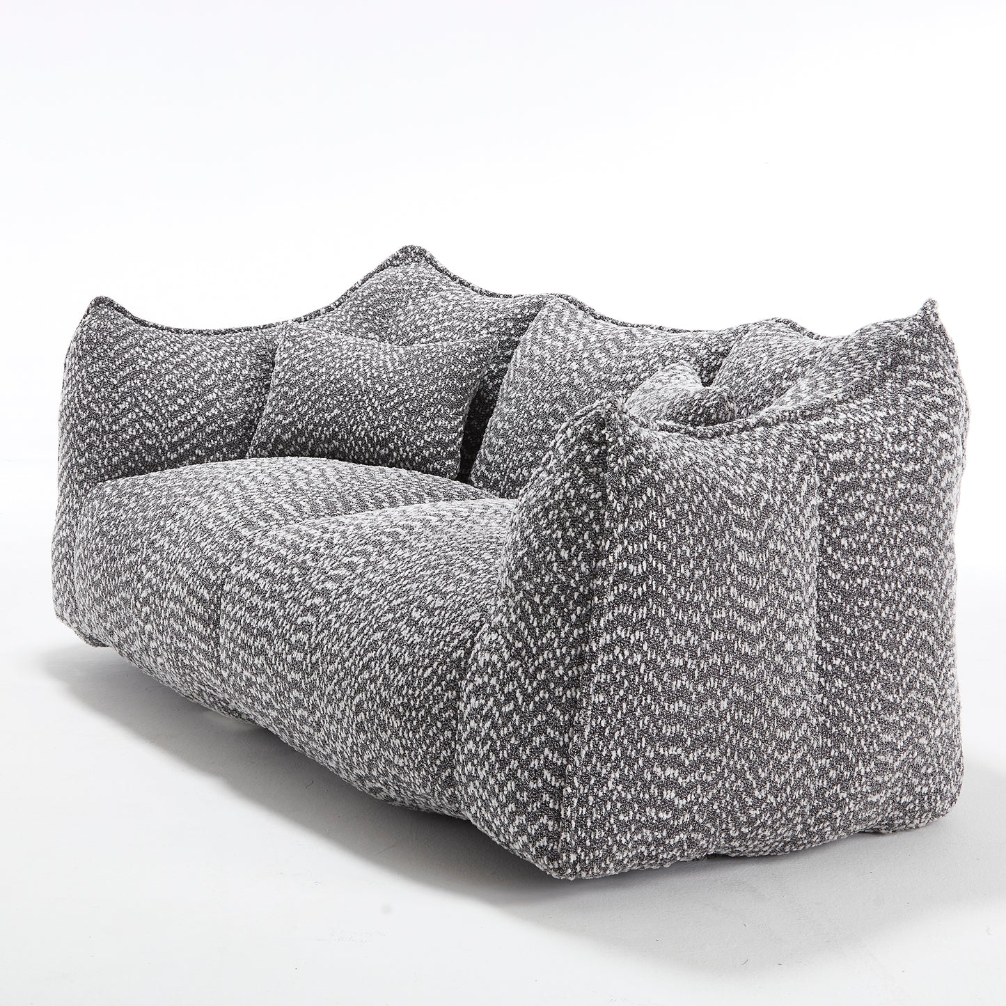 Plush grey and white boucle fabric sofa with textured chevron pattern and removable cushions