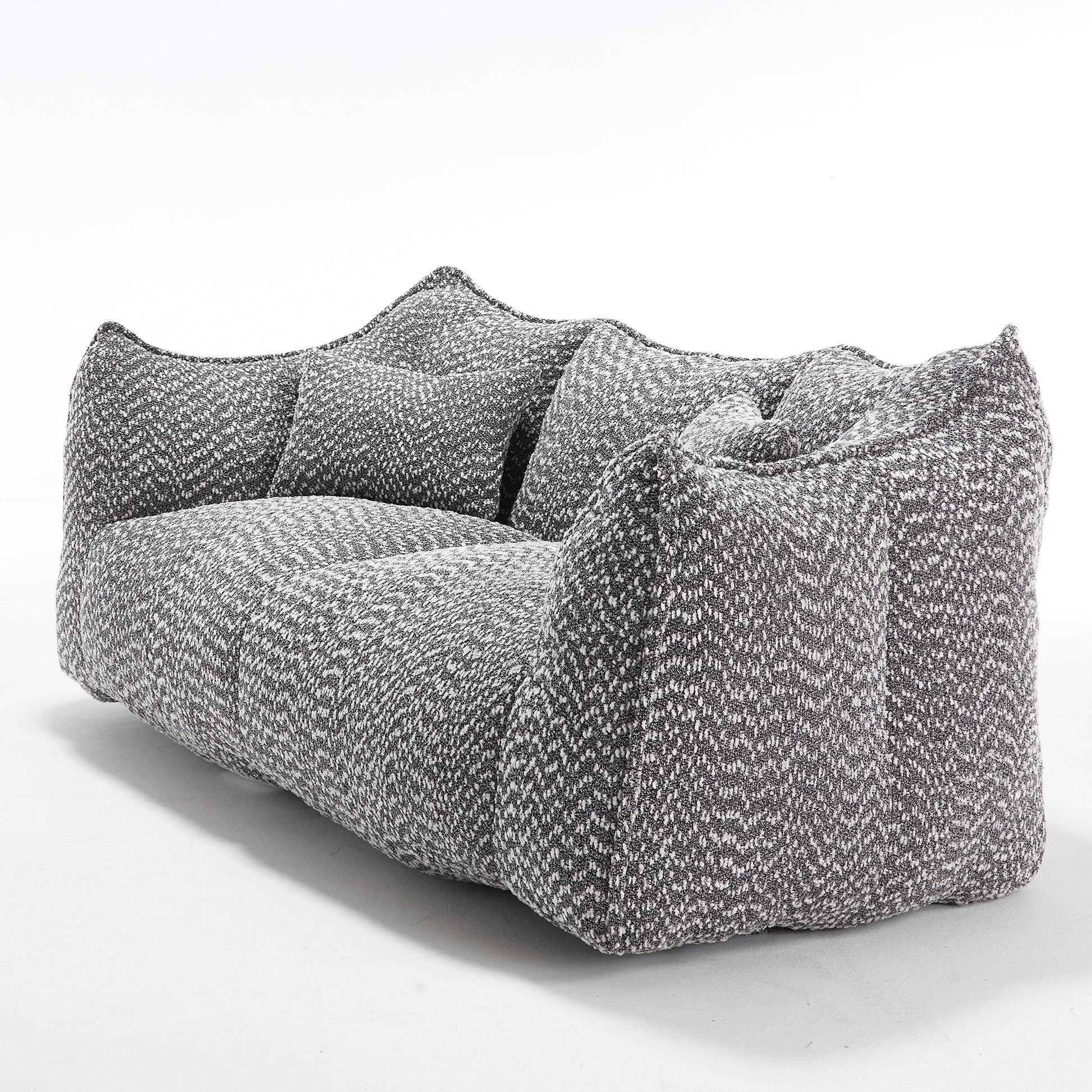 Plush grey and white boucle fabric sofa with textured chevron pattern and removable cushions