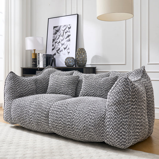 Plush modern sofa in a grey and white herringbone chenille fabric with oversized sinkin cushions