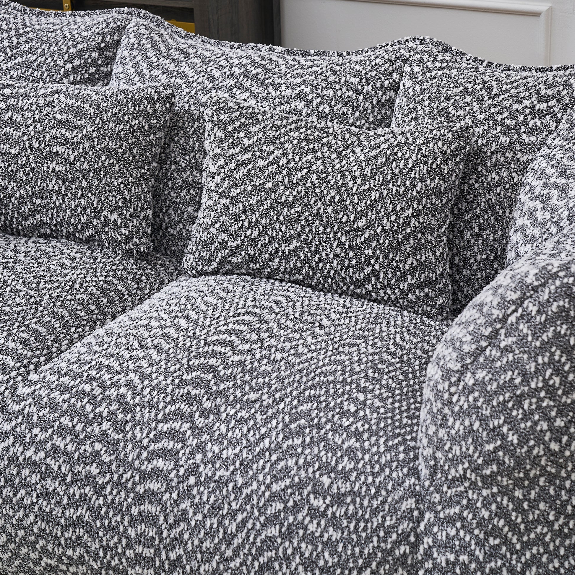 Cozy textured sofa with black and white chenille upholstery perfect for modern living rooms