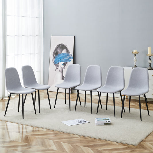 Set of six light gray fabric dining chairs with black metal legs modern design
