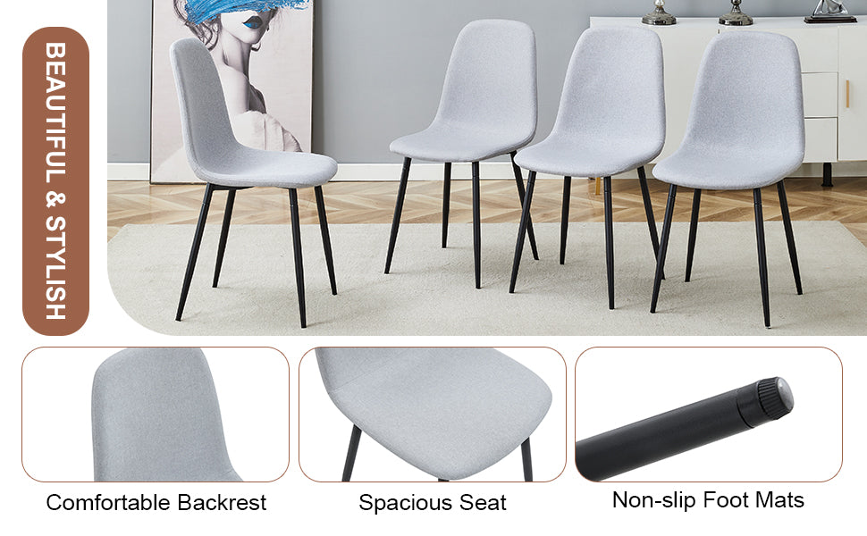 Four light grey fabric dining chairs with black metal legs arranged in a modern dining room setting