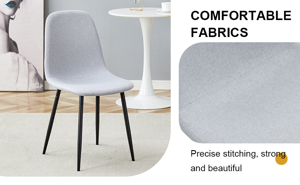 Light gray upholstered dining chair with black metal legs