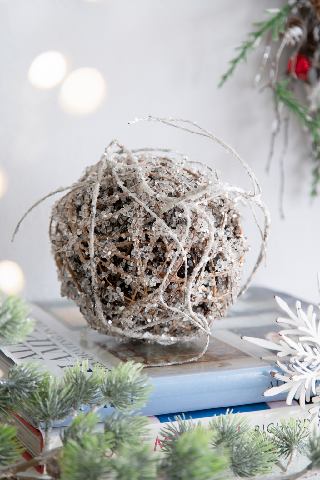 Sparkling silver beaded grapevine ball ornament with delicate white accents perfect for winter decor