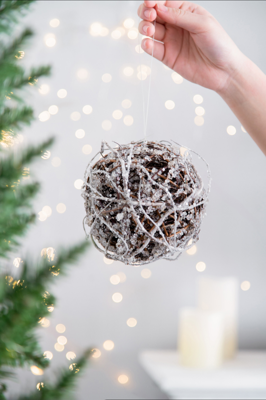 Textured sphere Christmas ornament with twig and crystal detail