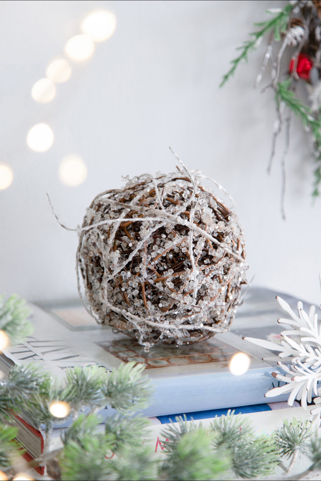 Frosted grapevine sphere ornament with glitter accents perfect for winter decor