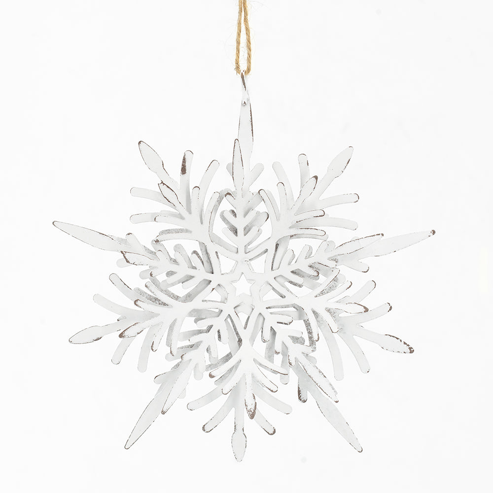 Distressed white metal snowflake ornament with rustic charm and twine hanger