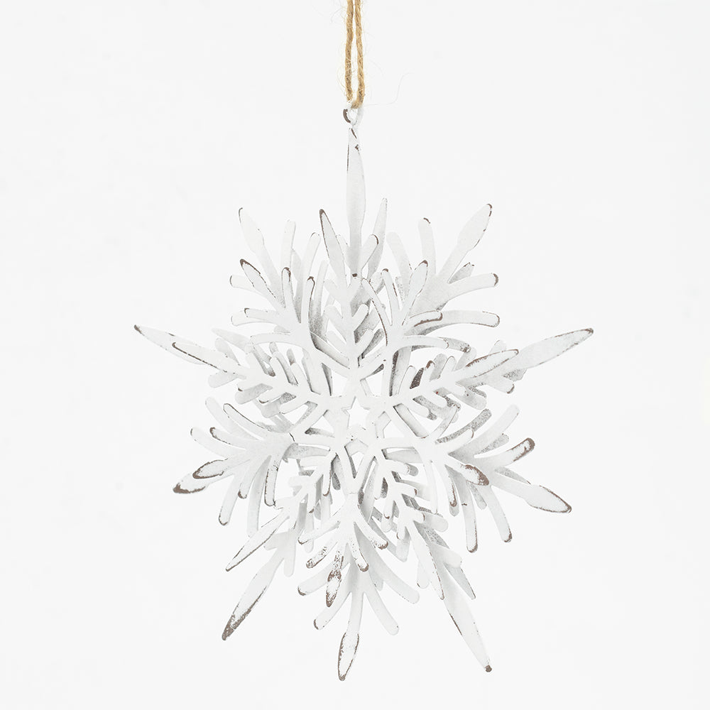 White metal snowflake ornament with rustic distressed finish perfect for winter decor