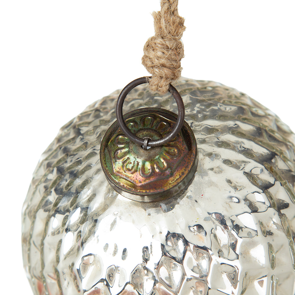 Antique mercury glass Christmas ornament with textured surface and jute hanger