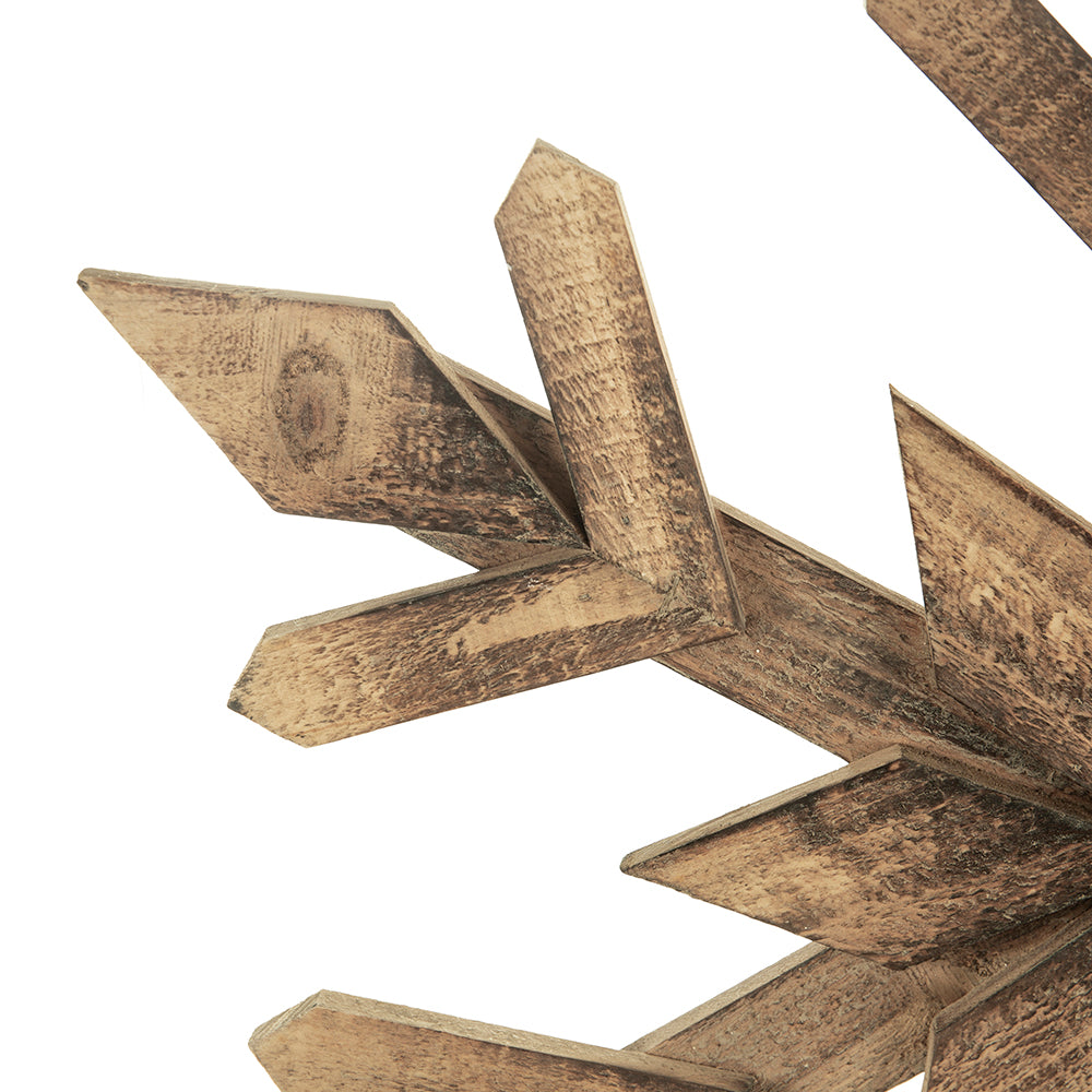 Weathered wooden directional signpost with multiple weathered brown arrow pointers