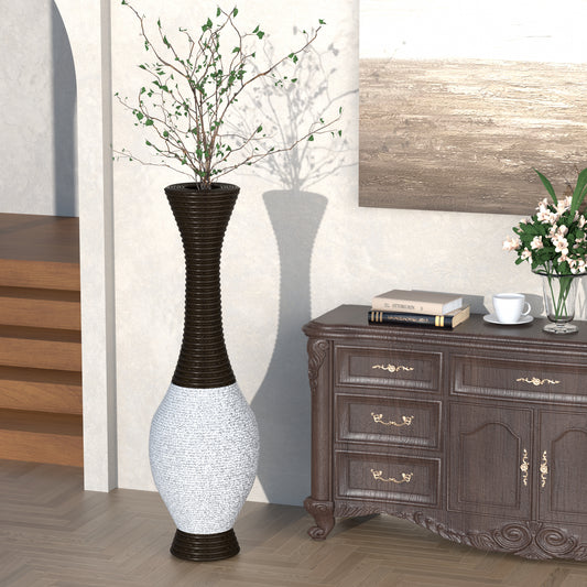 Tall elegant dark brown and white textured vase holding a green plant