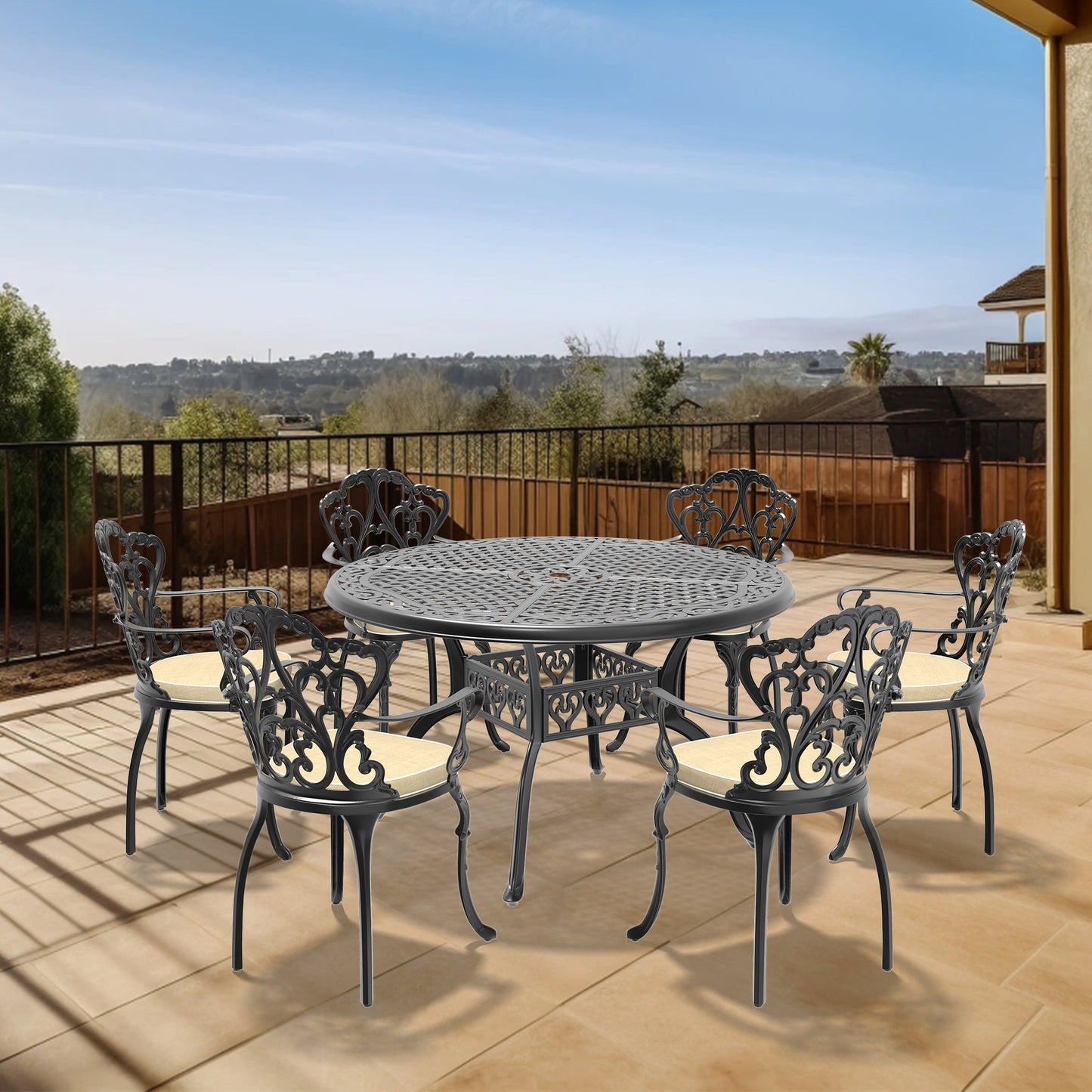 Black ornate cast aluminum patio dining set with cream cushions