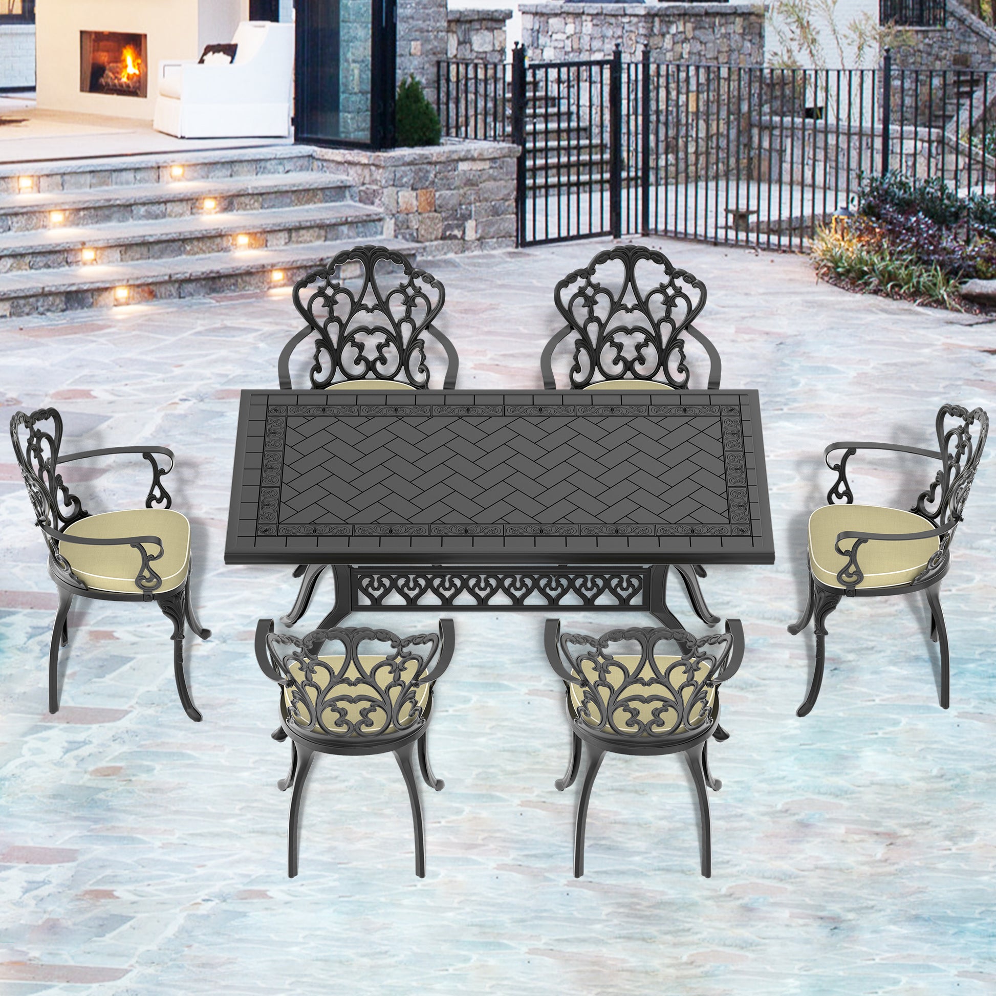 Ornate cast iron patio dining set with black metal table and upholstered chairs