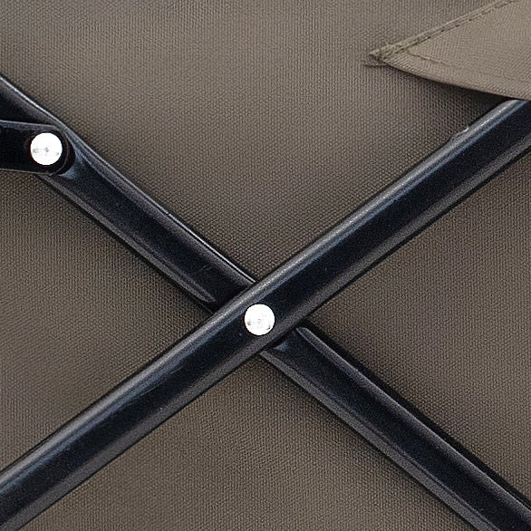 Closeup of a folding chairs dark metal frame and brown fabric seat