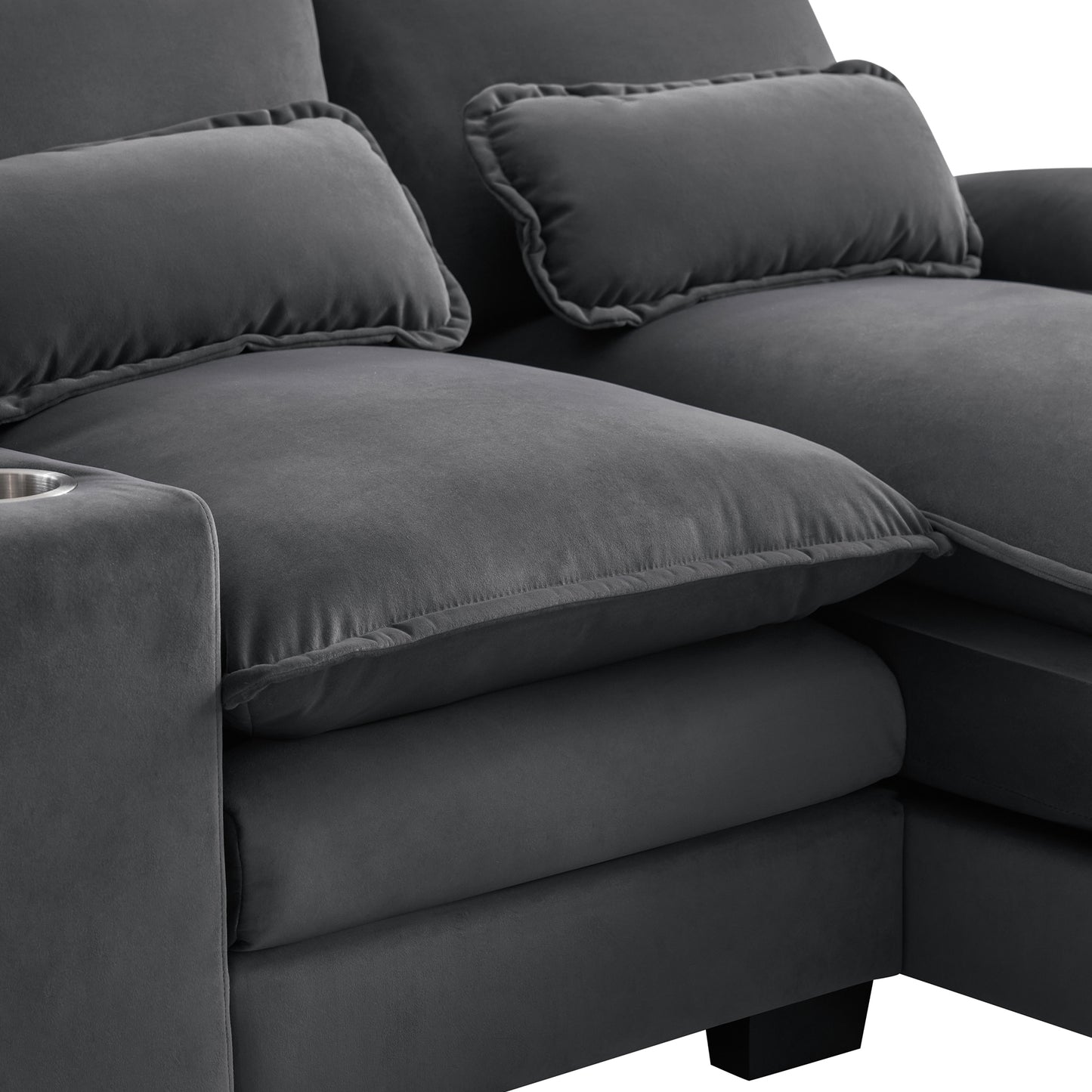 Dark gray velvet sectional sofa with plush cushions and integrated cup holder