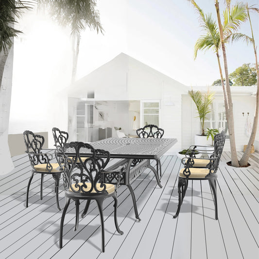 Ornate black cast aluminum patio dining set with six chairs and rectangular table