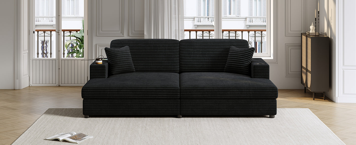 Black corduroy sectional sofa with integrated cup holders and throw pillows