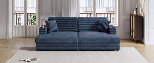 Deep blue corduroy sectional sofa with matching throw pillows and builtin cup holders