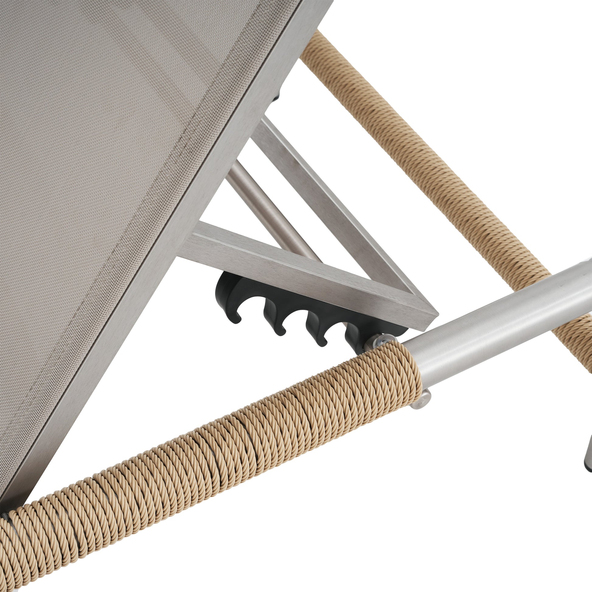 Close up of a tan ropewrapped aluminum frame on a patio lounge chair with textured grey fabric