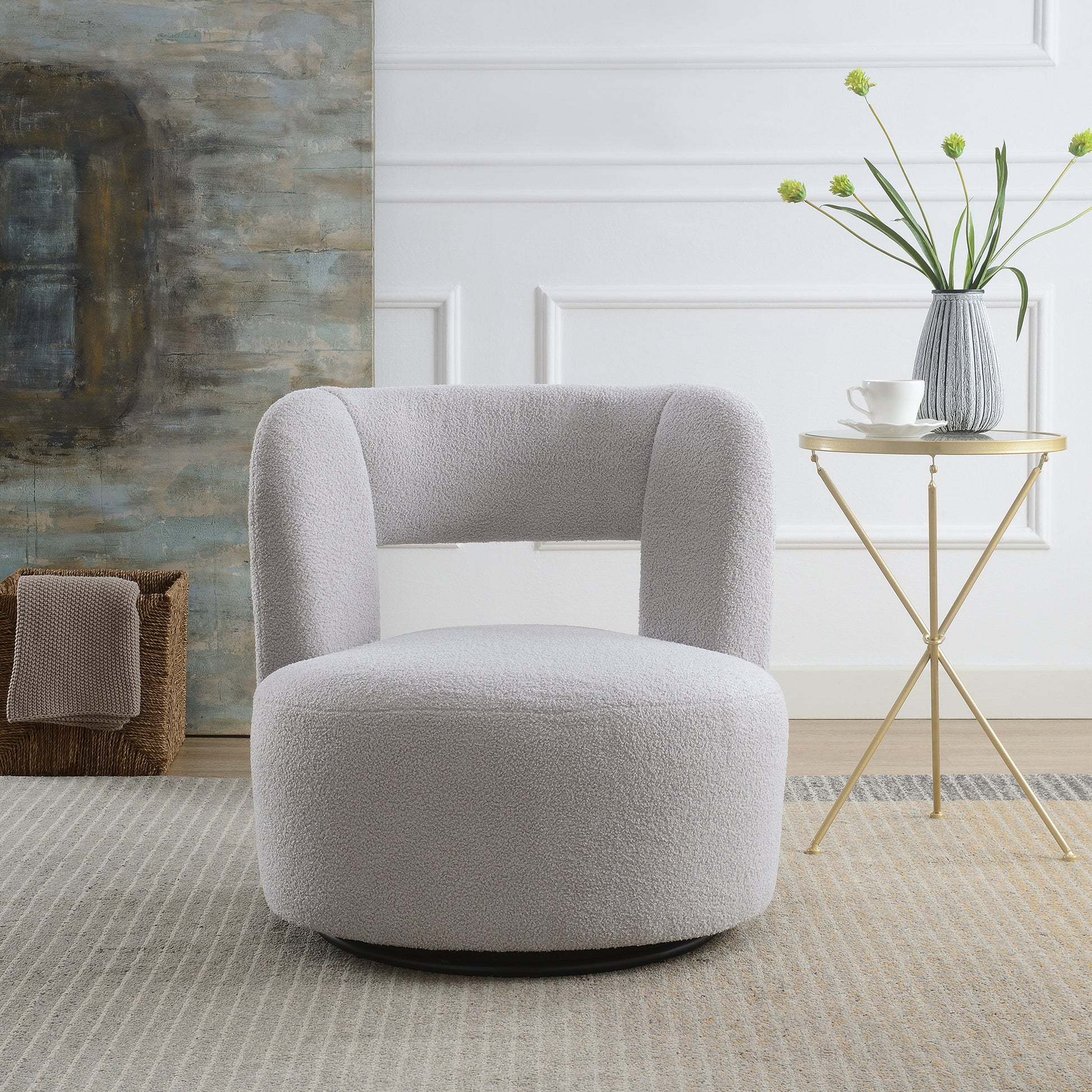 Light grey boucl swivel chair with curved back and plush seat