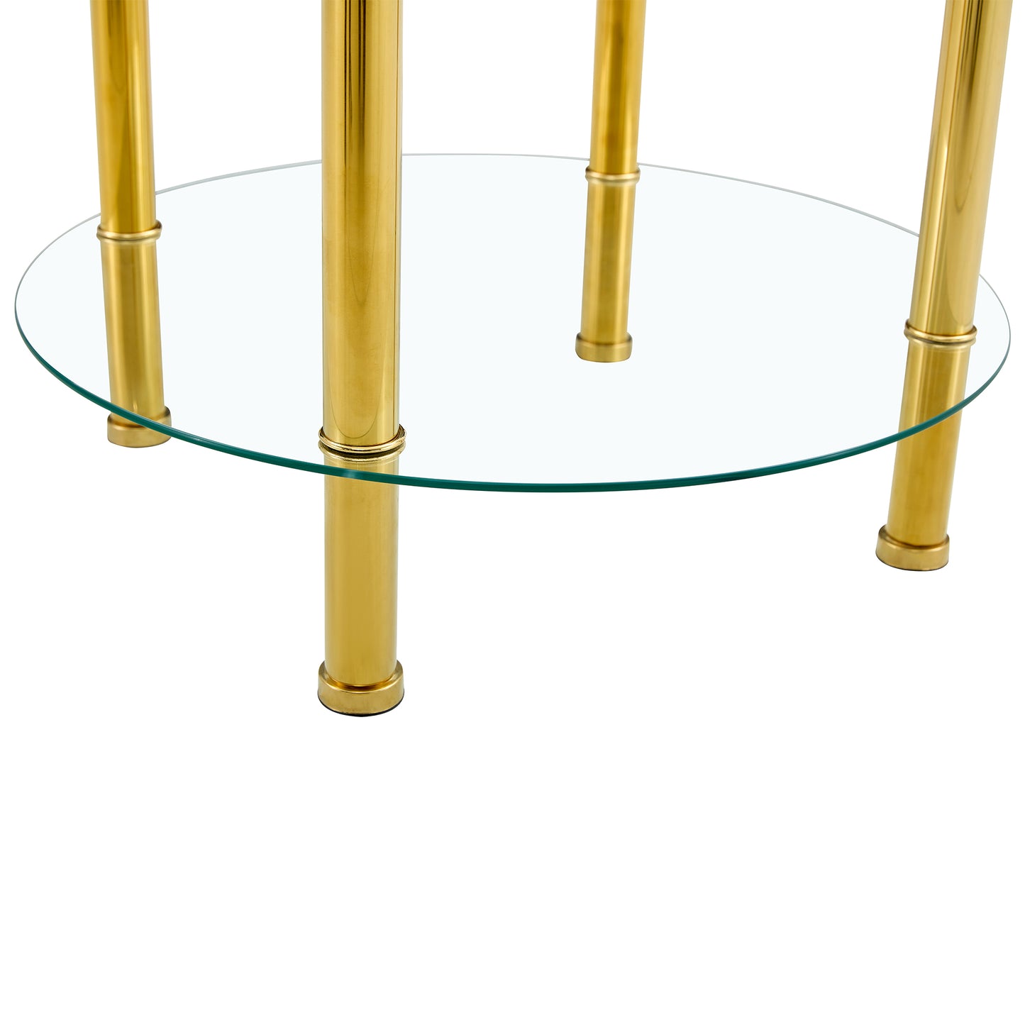 Round glass tabletop supported by four polished brass legs with decorative rings