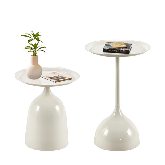 Sleek white metal accent table with a book and small plant ideal for modern living rooms