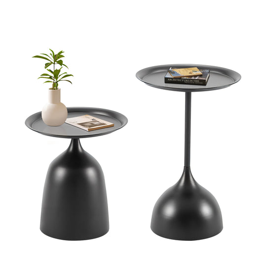 Sleek black metal side table with a round gray tray top holding a book