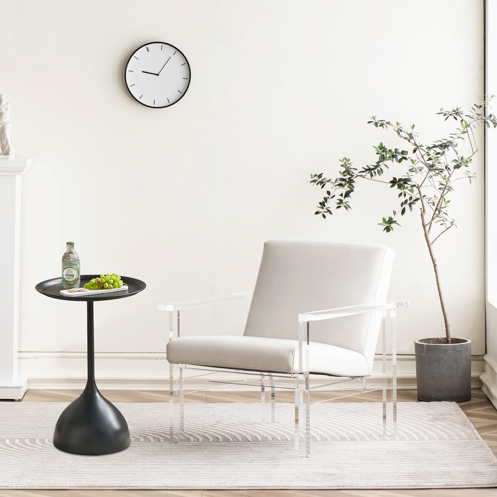 White upholstered modern armchair with clear acrylic legs and arms